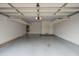 Spacious garage featuring overhead storage racks and an overhead light fixture at 15290 W Ventura St, Surprise, AZ 85379