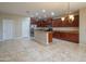 Eat-in kitchen features a large island, stainless steel appliances, and recessed lighting at 15290 W Ventura St, Surprise, AZ 85379