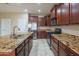Kitchen featuring granite countertops, stainless steel appliances, and ample cabinetry at 15290 W Ventura St, Surprise, AZ 85379