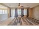 Living room with tile floors, backyard access, and views of the rear landscaped yard at 15290 W Ventura St, Surprise, AZ 85379