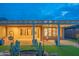 Beautiful covered patio and landscaped backyard, perfect for outdoor living and entertaining at 15290 W Ventura St, Surprise, AZ 85379