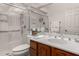Bathroom with glass shower, white vanity, and dark wood cabinets at 16724 E Gunsight Dr # 118, Fountain Hills, AZ 85268