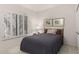 Cozy bedroom featuring neutral carpet and shuttered windows with bright natural light at 16724 E Gunsight Dr # 118, Fountain Hills, AZ 85268