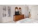 Bedroom with white walls, natural light, and a wooden dresser with shuttered window at 16724 E Gunsight Dr # 118, Fountain Hills, AZ 85268