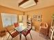Community room with table, chairs, and natural light from a large window at 16724 E Gunsight Dr # 118, Fountain Hills, AZ 85268