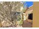 Charming home entrance with a welcoming walkway, desert landscaping, and inviting door at 16724 E Gunsight Dr # 118, Fountain Hills, AZ 85268