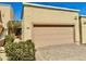 Attached garage with a private driveway and desert landscaping surrounding at 16724 E Gunsight Dr # 118, Fountain Hills, AZ 85268