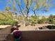 Patio view of manicured community landscaping and nearby buildings on a clear day at 16724 E Gunsight Dr # 118, Fountain Hills, AZ 85268