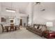 Inviting living room featuring high ceilings, neutral colors, and open dining area at 16724 E Gunsight Dr # 118, Fountain Hills, AZ 85268