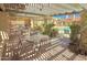 Covered outdoor seating area near the pool with tables and chairs for relaxing at 16724 E Gunsight Dr # 118, Fountain Hills, AZ 85268