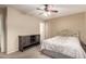Neutral-toned bedroom featuring carpet, a ceiling fan, a queen size bed and a dark dresser at 16737 N 157Th Ave, Surprise, AZ 85374