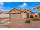 Single-Gathering home with a two-car garage, desert landscaping and a well-maintained front yard at 16737 N 157Th Ave, Surprise, AZ 85374