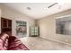 Open living area with tile flooring, sliding glass doors, and a vibrant accent cabinet at 16737 N 157Th Ave, Surprise, AZ 85374