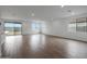 Bright, expansive living area with sleek tile floors, lots of natural light, and access to the backyard at 17310 W Via Dona Rd, Surprise, AZ 85387