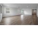 Large, open living area with tile flooring, recessed lighting, and several windows for ample natural light at 17310 W Via Dona Rd, Surprise, AZ 85387