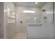 Modern walk-in shower featuring white subway tile, glass enclosure, and a rainfall shower head at 17310 W Via Dona Rd, Surprise, AZ 85387