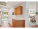Hallway area with cabinets, countertop, and easy access to the bedroom and living area at 19835 N Alta Loma Dr, Sun City West, AZ 85375