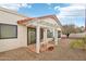 Enjoy this private patio area with tiled floors, a pergola, and ample space for outdoor seating at 19835 N Alta Loma Dr, Sun City West, AZ 85375
