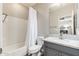 Bathroom with a shower-tub combination, gray vanity with light countertop and a stylish mirror at 20088 E Maya Rd, Queen Creek, AZ 85142