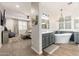 Luxurious bathroom with a standalone tub, shiplap walls, and dual vanities at 20088 E Maya Rd, Queen Creek, AZ 85142