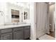 A bright bathroom with a gray vanity, white countertops, a mirror, and a shower-tub combination at 20088 E Maya Rd, Queen Creek, AZ 85142