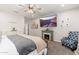 Serene bedroom featuring a fireplace, comfortable seating area, and soft natural light at 20088 E Maya Rd, Queen Creek, AZ 85142