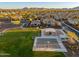 Scenic aerial view of the community park with a playground, basketball court, and surrounding homes at 20088 E Maya Rd, Queen Creek, AZ 85142