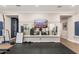 Spacious exercise room with wall-mounted TV, large mirror, weight equipment, and rubber flooring at 20088 E Maya Rd, Queen Creek, AZ 85142