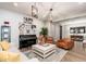Stylish living room with hardwood floors, a grand piano, a neutral sofa, and designer decor at 20088 E Maya Rd, Queen Creek, AZ 85142