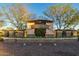 Elegant community entrance sign with stone accents and manicured landscaping at 20088 E Maya Rd, Queen Creek, AZ 85142
