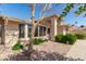 Beautifully landscaped front yard with a mature tree and a well-maintained facade at 20215 N Broken Arrow Dr, Sun City West, AZ 85375