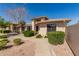 Inviting single-story home featuring desert landscaping and a paved walkway at 20215 N Broken Arrow Dr, Sun City West, AZ 85375