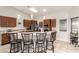 Open kitchen with a breakfast bar, modern appliances, and stylish pendant lighting at 20215 N Broken Arrow Dr, Sun City West, AZ 85375