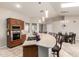 Well-lit kitchen with a breakfast bar, tile floors, and stainless steel appliances at 20215 N Broken Arrow Dr, Sun City West, AZ 85375