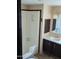 Cozy bathroom space with step-in shower and a classic sink with cabinets at 205 S Higley Rd # 8, Mesa, AZ 85206