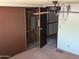 A bedroom features a closet with sliding doors and carpet flooring at 205 S Higley Rd # 8, Mesa, AZ 85206