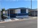 Charming mobile home featuring a screen room and white and blue color scheme at 205 S Higley Rd # 8, Mesa, AZ 85206