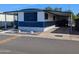 Charming mobile home featuring covered parking and white and blue color scheme at 205 S Higley Rd # 8, Mesa, AZ 85206