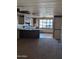 Cozy eat-in kitchen featuring dark cabinets, a breakfast bar, and bright window at 205 S Higley Rd # 8, Mesa, AZ 85206