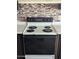 Kitchen featuring a white electric range with dark brown cabinetry at 205 S Higley Rd # 8, Mesa, AZ 85206