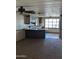 Kitchen with brown cabinets, white countertops, and tiled backsplash at 205 S Higley Rd # 8, Mesa, AZ 85206