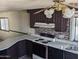 Kitchen with brown cabinets, white countertops, and tiled backsplash at 205 S Higley Rd # 8, Mesa, AZ 85206