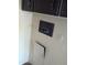 The utility space featuring the access for plumbing and electric panel at 205 S Higley Rd # 8, Mesa, AZ 85206