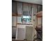 Cluttered storage area with corrugated metal walls, shelving, and miscellaneous building materials at 205 S Higley Rd # 8, Mesa, AZ 85206