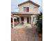 Cozy covered back patio with gravel landscaping and a charming exterior view at 2102 N Garrett Dr, Chandler, AZ 85225