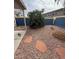 A serene backyard featuring gravel landscaping, stone accents, and lush greenery at 2102 N Garrett Dr, Chandler, AZ 85225