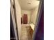 Bathroom featuring a tub and shower, sink, tiled floors, and painted purple accent wall at 2102 N Garrett Dr, Chandler, AZ 85225