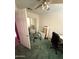 Bedroom featuring white walls, carpeted floor, a door mirror, a ceiling fan, and exercise equipment at 2102 N Garrett Dr, Chandler, AZ 85225