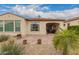 Picturesque backyard showcasing a paved patio, desert landscaping, and lush greenery for a private outdoor oasis at 229 E Alcatara Ave, Queen Creek, AZ 85140