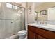 Inviting bathroom features granite countertops, a glass shower, and warm lighting at 229 E Alcatara Ave, Queen Creek, AZ 85140